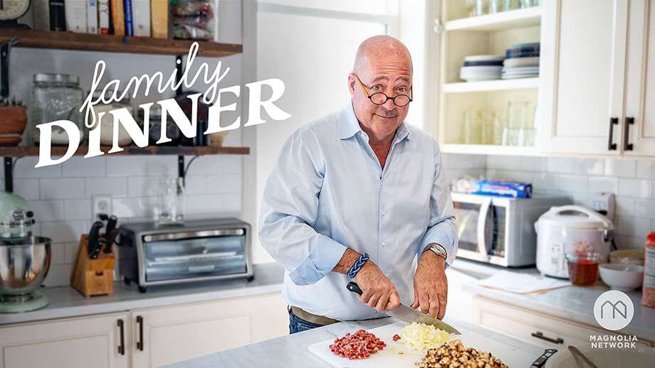 Man cutting up food in a kitchen with a magnolia network logo