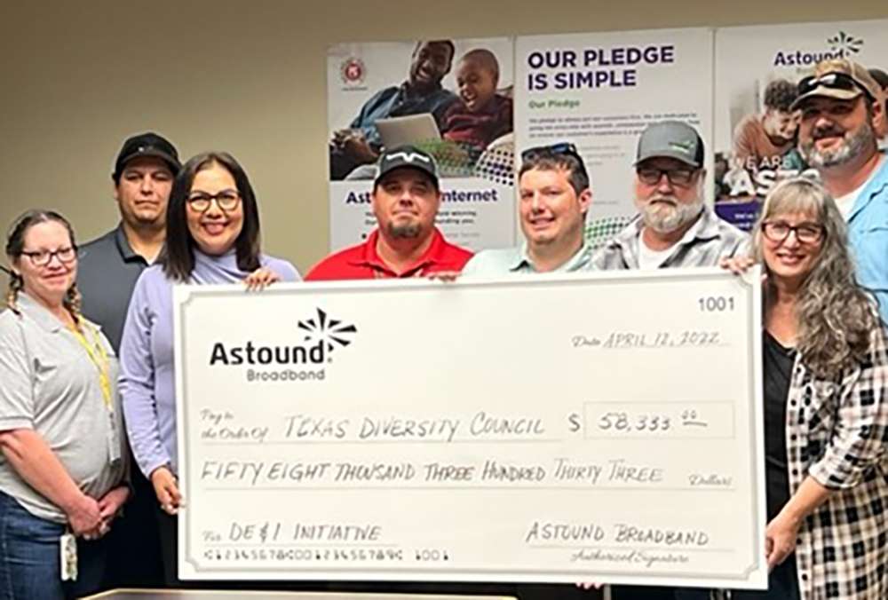 astound handing a giant check to texas diversity council