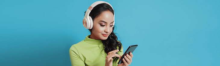 Woman in headphones on phone